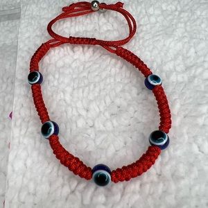 red thread bracelet is new it is in its packaging as it comes in the photo